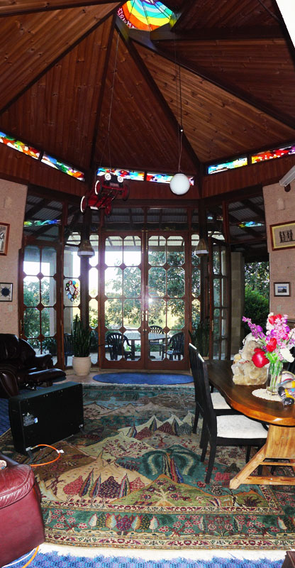 vertical panorama of the main room looking towards the water view